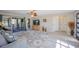 Bright living room with tile floors, ceiling fan, and sliding glass doors to lanai at 4381 Northshore Dr, Punta Gorda, FL 33980