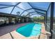 This sparkling screened-in pool offers a refreshing oasis with lush landscaping and a peaceful atmosphere at 4381 Northshore Dr, Punta Gorda, FL 33980