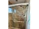 Close-up of shower featuring tiled walls and glass door at 4381 Northshore Dr, Punta Gorda, FL 33980
