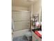 A bathroom includes a vanity and a shower-tub combo enclosed with a frosted glass sliding door at 501 San Cristobal Ave, Punta Gorda, FL 33983