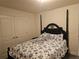 Bedroom with a queen bed, dual closets, and neutral paint tones offers a tranquil retreat at 501 San Cristobal Ave, Punta Gorda, FL 33983