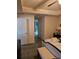 Spacious bedroom with king bed, white door, and tiled floor at 501 San Cristobal Ave, Punta Gorda, FL 33983