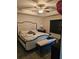 Bedroom with ceiling fan, king bed, and sitting bench near a window at 501 San Cristobal Ave, Punta Gorda, FL 33983