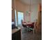 A dining area with a four-seat table and natural lighting from the window at 501 San Cristobal Ave, Punta Gorda, FL 33983