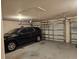 A spacious two-car garage with a car parked inside showcases ample room for vehicles and storage at 501 San Cristobal Ave, Punta Gorda, FL 33983