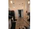 A kitchen with stainless steel appliances, white cabinets, granite counters, and tile floors at 501 San Cristobal Ave, Punta Gorda, FL 33983