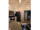 A kitchen with granite counters, stainless appliances, mosaic backsplash, and white cabinets at 501 San Cristobal Ave, Punta Gorda, FL 33983