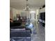 Open-concept living room with tile floors, contemporary lighting, and stylish furniture at 501 San Cristobal Ave, Punta Gorda, FL 33983