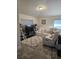 Cozy living area featuring a comfortable sectional sofa, tv, and neutral decor at 501 San Cristobal Ave, Punta Gorda, FL 33983