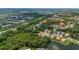 Wide aerial shot of a community showcasing the home's location with water views and surrounding greenery at 5017 Hanging Moss Ln, Sarasota, FL 34238