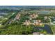 Expansive aerial view shows the home's location near waterways and a preserved green space in the community at 5017 Hanging Moss Ln, Sarasota, FL 34238