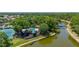 Great aerial view of a community park featuring a playground, tennis court and picnic area near a lake at 5017 Hanging Moss Ln, Sarasota, FL 34238