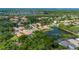 Panoramic aerial view highlights the property's proximity to a pond and a preserved natural area at 5017 Hanging Moss Ln, Sarasota, FL 34238