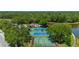 Aerial view of community amenities featuring a swimming pool, tennis courts and basketball court at 5017 Hanging Moss Ln, Sarasota, FL 34238