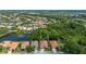 Aerial view showcasing the property's location, bordering a lush green space and serene ponds at 5017 Hanging Moss Ln, Sarasota, FL 34238
