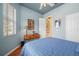 A cozy bedroom painted blue with natural light and wood floors creates a peaceful retreat at 5017 Hanging Moss Ln, Sarasota, FL 34238