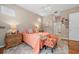 Bright bedroom with a cozy bed, ceiling fan, and natural light, creating a relaxing atmosphere at 5017 Hanging Moss Ln, Sarasota, FL 34238