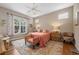 Bright bedroom featuring hardwood flooring, windows, neutral paint colors and decorative rug at 5017 Hanging Moss Ln, Sarasota, FL 34238