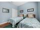 Comfortable bedroom with two twin beds, natural light, and a relaxing atmosphere at 5017 Hanging Moss Ln, Sarasota, FL 34238