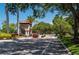 Gated community entrance with lush landscaping, providing security and a welcoming arrival at 5017 Hanging Moss Ln, Sarasota, FL 34238