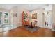 Charming dining area featuring an orange china cabinet, and a round table set on a colorful rug at 5017 Hanging Moss Ln, Sarasota, FL 34238