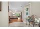 Elegant foyer featuring wood floors and an open view of the living room at 5017 Hanging Moss Ln, Sarasota, FL 34238