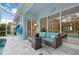 Enjoy a well-furnished lanai with views of the pool and lush outdoor space at 5017 Hanging Moss Ln, Sarasota, FL 34238