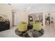 Open-concept living room with cozy seating, and seamless flow to dining area and kitchen at 5017 Hanging Moss Ln, Sarasota, FL 34238