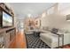 Spacious living room with a comfortable sectional sofa, tv and hardwood floors at 5017 Hanging Moss Ln, Sarasota, FL 34238