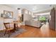 Open-concept living room with wood floors and lots of natural light at 5017 Hanging Moss Ln, Sarasota, FL 34238