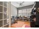 Cozy office featuring natural light, a work space, hardwood flooring and glass french doors at 5017 Hanging Moss Ln, Sarasota, FL 34238
