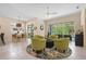 Cozy sitting area with view to the dining table and the outdoor pool at 5017 Hanging Moss Ln, Sarasota, FL 34238