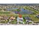 Stunning aerial view of home with lake and golf course in the background at 507 Monaco Dr, Punta Gorda, FL 33950