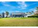 Wide open backyard with screened-in lanai, perfect for outdoor living at 507 Monaco Dr, Punta Gorda, FL 33950