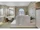 Bright bathroom with floral wallpaper, large walk-in tub, and vanity at 507 Monaco Dr, Punta Gorda, FL 33950