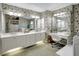 Bright bathroom featuring dual sinks, a vanity, and floral wallpaper at 507 Monaco Dr, Punta Gorda, FL 33950