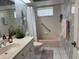 Bathroom featuring a classic sink with storage and a shower-tub combo, providing functionality at 507 Monaco Dr, Punta Gorda, FL 33950
