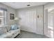 Cozy bedroom with plush sofa, window with blinds, and closet, creating a relaxing retreat at 507 Monaco Dr, Punta Gorda, FL 33950