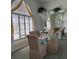 The dining room features chairs and a mirror adding elegance to the room at 507 Monaco Dr, Punta Gorda, FL 33950