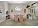 Formal dining room featuring a chandelier, large window, and elegant furnishings for sophisticated gatherings at 507 Monaco Dr, Punta Gorda, FL 33950