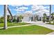 Well-maintained home exterior with lush landscaping and driveway at 507 Monaco Dr, Punta Gorda, FL 33950