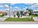 Home with driveway, lush landscaping and architectural details at 507 Monaco Dr, Punta Gorda, FL 33950