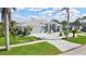 Beautiful home with meticulous landscaping, driveway and mature palm trees at 507 Monaco Dr, Punta Gorda, FL 33950