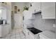 Efficient kitchen with white cabinetry and modern appliances, perfect for cooking and meal preparation at 507 Monaco Dr, Punta Gorda, FL 33950
