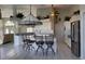 Bright, open kitchen with white cabinets, stainless steel appliances, a large island, and bar stool seating at 507 Monaco Dr, Punta Gorda, FL 33950