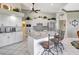 Bright kitchen with white cabinetry, stainless steel appliances, and a breakfast bar for easy meals at 507 Monaco Dr, Punta Gorda, FL 33950