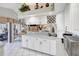 Bright kitchen with bar seating, wine rack and an open view to the living room, perfect for hosting guests at 507 Monaco Dr, Punta Gorda, FL 33950