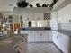 Bright kitchen featuring white cabinetry with dark hardware, providing ample storage space at 507 Monaco Dr, Punta Gorda, FL 33950