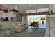 Bright living room with comfortable seating and a view of the lake, perfect for relaxing at 507 Monaco Dr, Punta Gorda, FL 33950