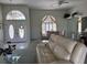 A living area featuring an archway and front entrance with tiled floors and carpet at 507 Monaco Dr, Punta Gorda, FL 33950